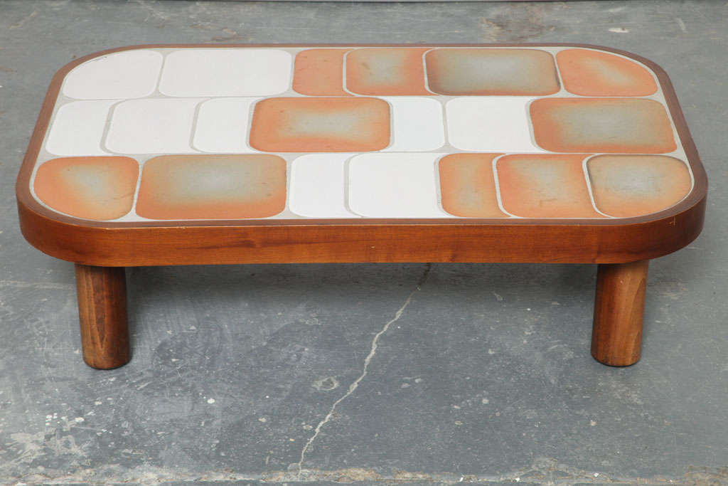 This table is unique in that it features the rare textured orange/grey variety of rhythmical 