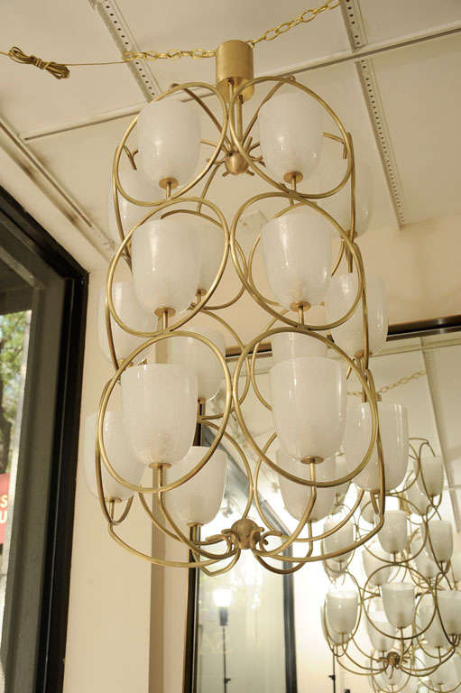 Mid-20th Century Large scale brass chandelier featuring white glass shades