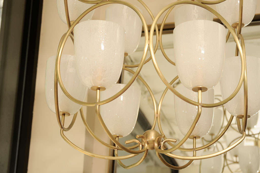 Large scale brass chandelier featuring white glass shades 2