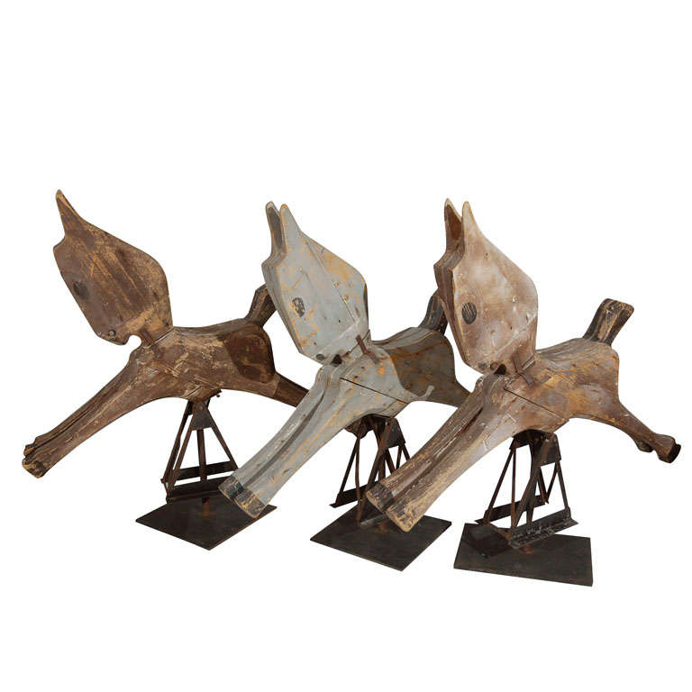 These carousel horses, from an early 20th century Vermont park, are rare in their simplicity of form. Please note that these are priced individually. The gray horse in the group picture has sold. The two brown horses are available. Each horse comes