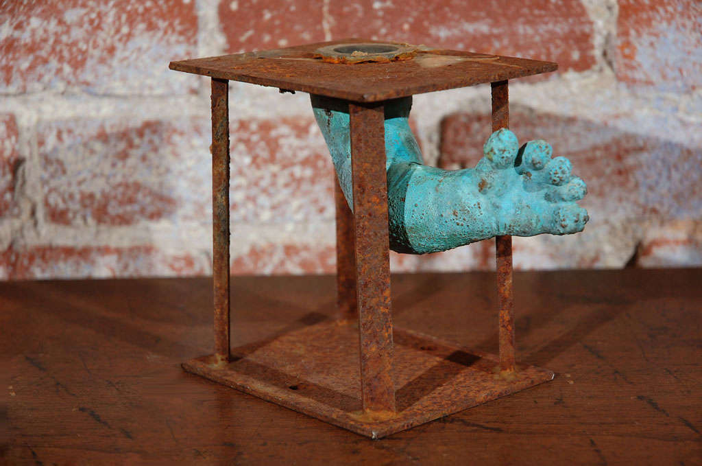 Baby doll arm mold from a toy factory in the bronx.  Arm  reaches out past original manufacturing apparatus.  Layered and patinated surface due to exposure to various chemicals and high heat during the manufacturing process.  Great bookshelf piece. 
