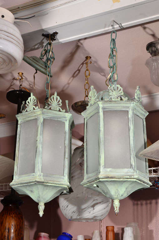 Bronze hanging lanterns; recreation of an early 20th century American lantern (from one held in the archives of Rejuvination Hardware) in verdigris patina. Made for a project but never used (sold initially for $1750. each.) Priced today at $1200.00