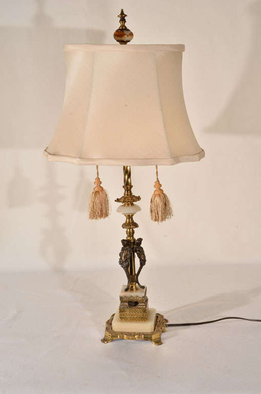 Cast bronze and marble, three nymph figures in casting, priced without lampshade. Shade shown is $150.