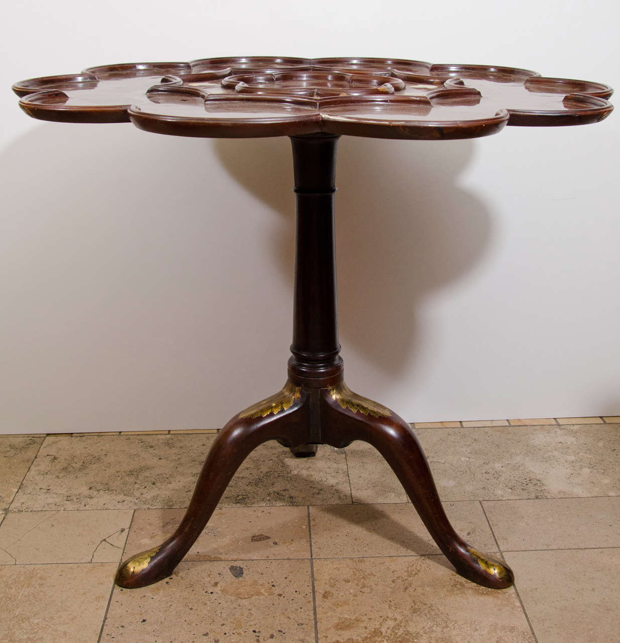 An unusual George I tilt-top inlaid supper table, 19th century.