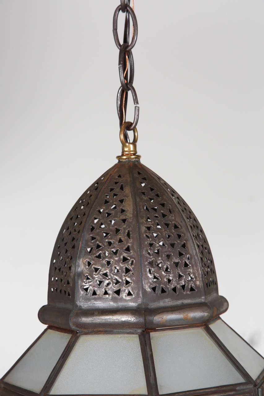 Handcrafted Moroccan milky glass lantern, rewired ready to hang.
Single light source one socket. Up to 60 watt max.
Hispano Moresque style pendant comes with chains and canopy, chains could be adjusted to your needs.
We have a pair available, 
Price