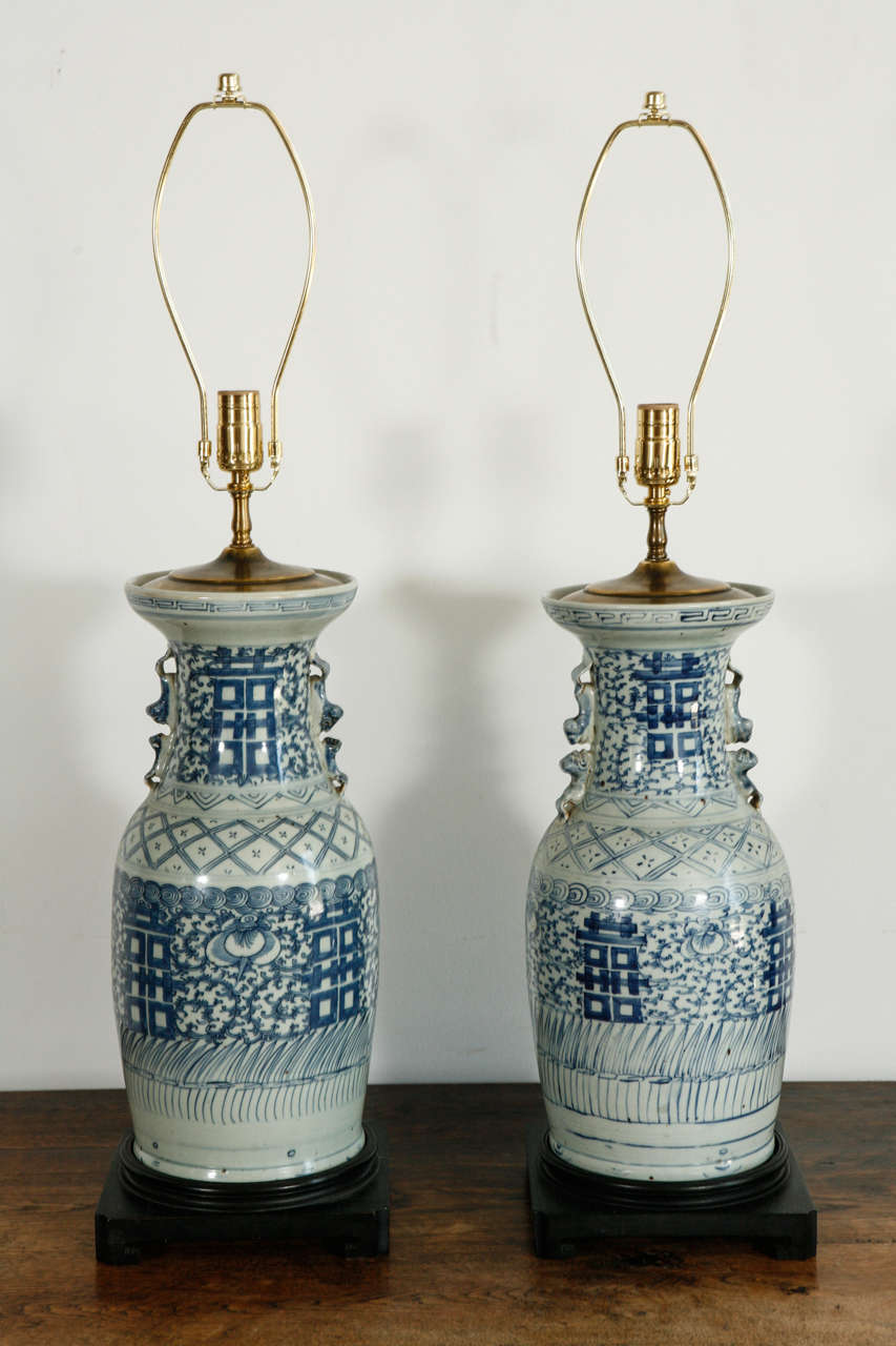 Blue and white ginger gar ceramic jar lamps. Rewired with black silk twist cords. Measures 24