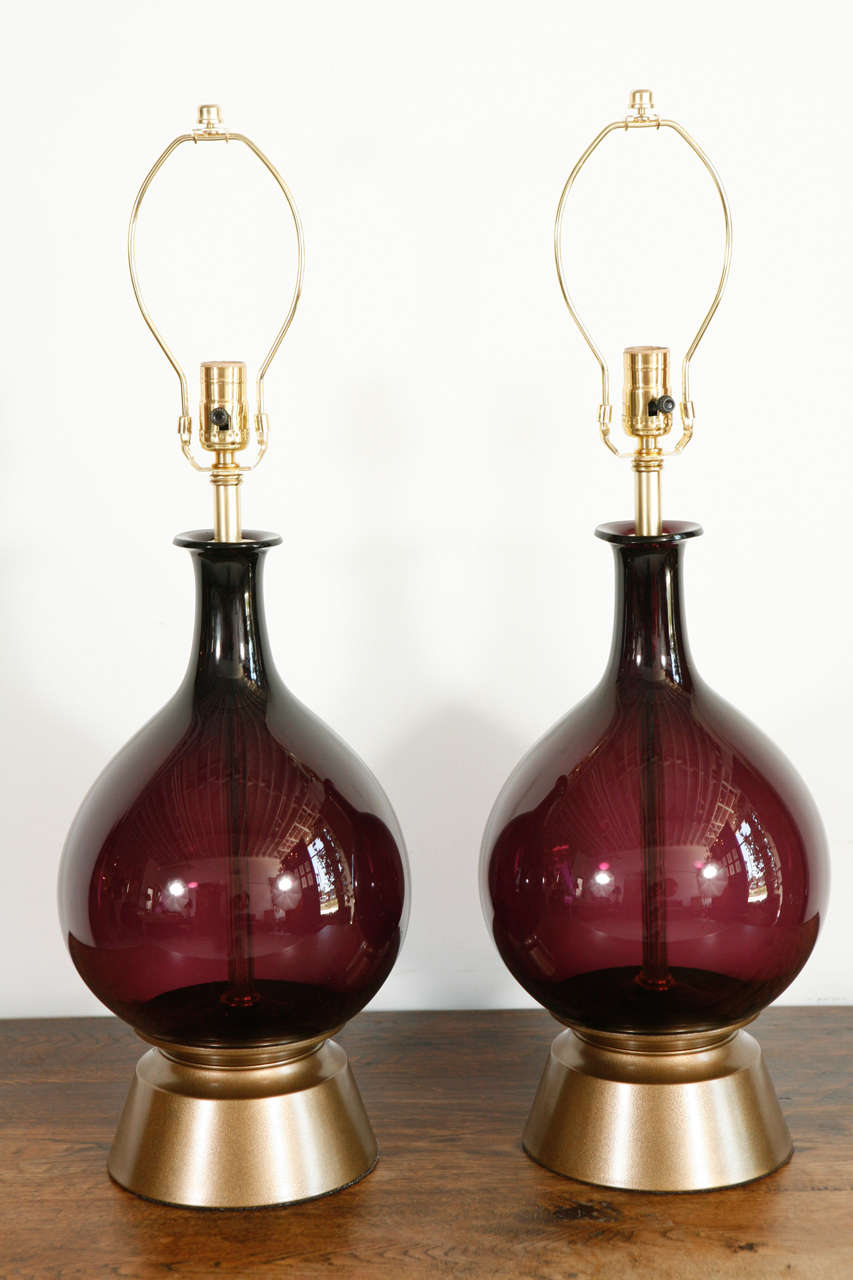 Mid-Century purple glass lamps in elegant gourd shape. Measures 23