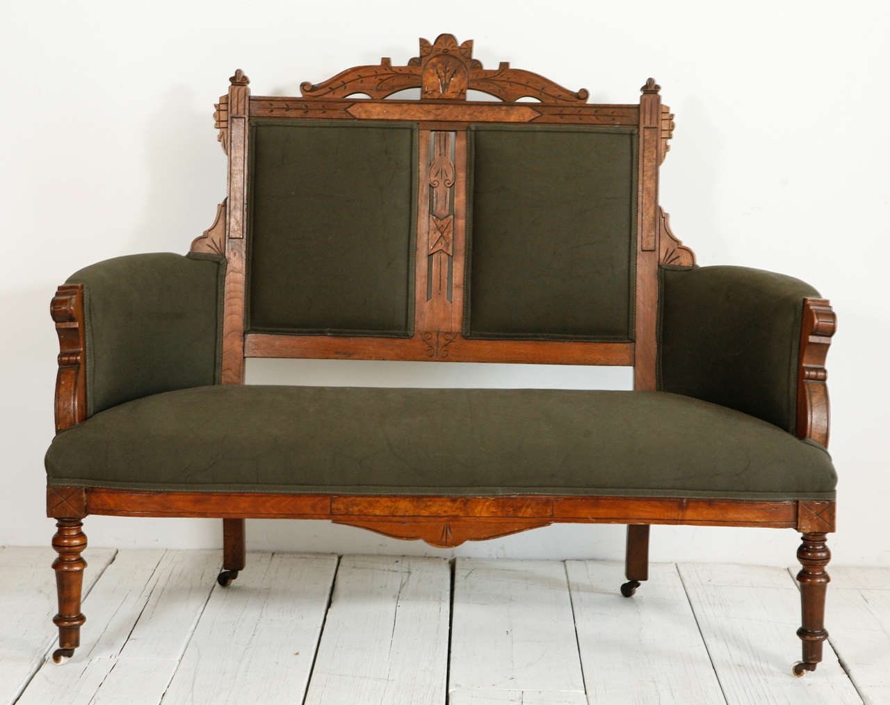 Edwardian-style wood frame newly reupholstered in a cotton army green canvas.