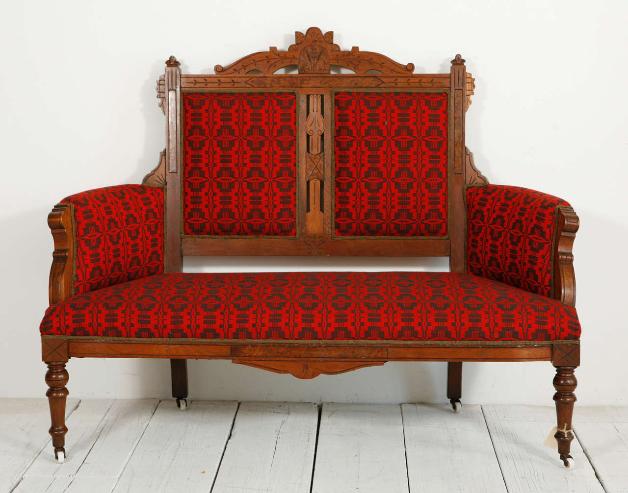 Edwardian-style wood frame newly reupholstered in a striking vintage geometric African cotton fabric.