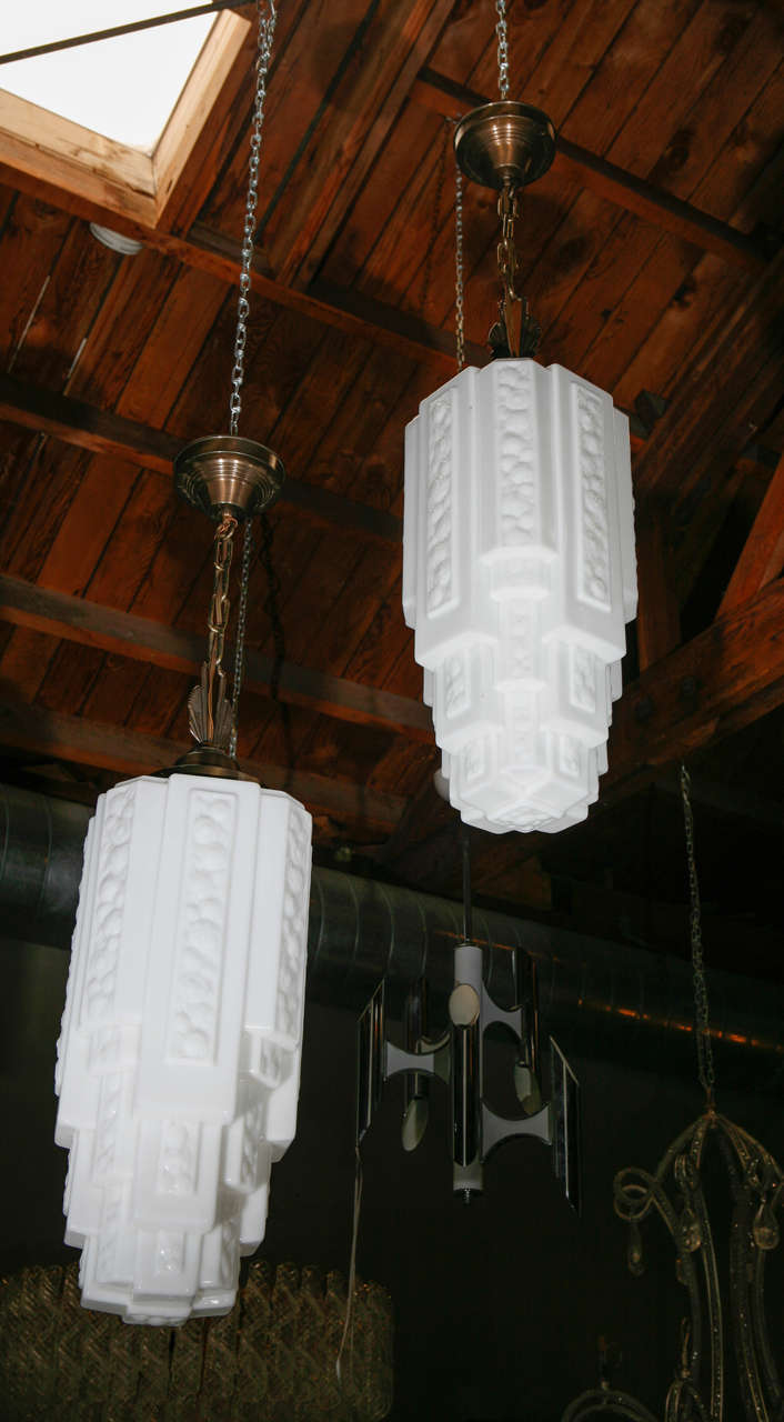 Fine Pair of Art Deco Pendants
The dimensions indicated below are just for the body of the chandelier. 
the canopy is extra 9