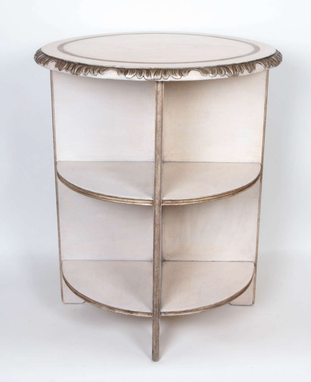 A 1930s side table by Syrie Maugham, with silver-leafing and a craqueleur-paint finish.
