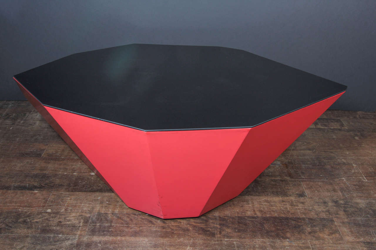 One of three unique tables made by the New York artist John Torreano in the mid 1980s, which were then shown in a one-man exhibition at the Hamilton gallery. The painted-wood form is derived from a faceted jewel, and surfaced with a black