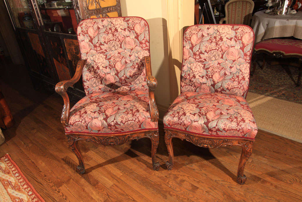 Set of 12 carved Baroque style dining chairs.