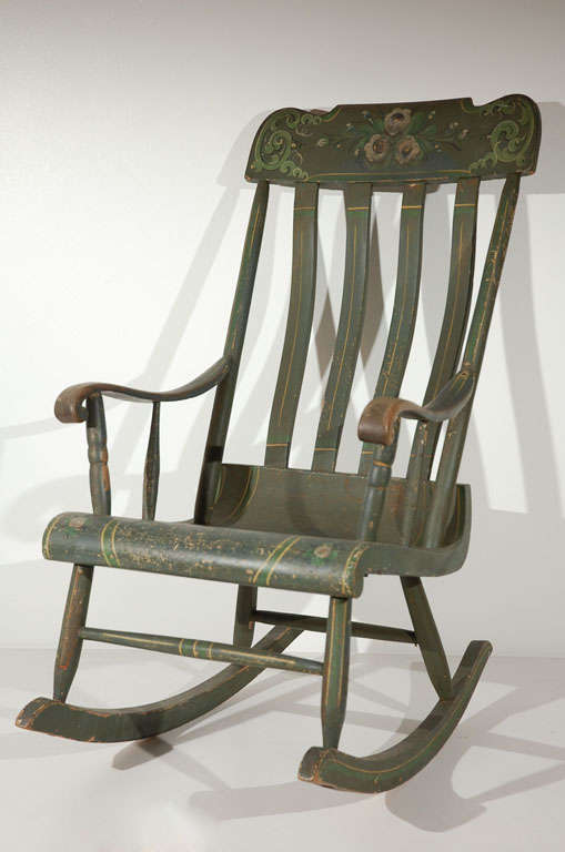 19THC ALL ORIGINAL PAINT DECORATED HAND MADE ROCKING CHAIR FROM LANCASTER COUNTY, PENNSYLVANIA .THIS ORIGINAL PAINTED AND DECORATED ROCKER IS IN FANTASTIC CONDITION.THE FORM IS WONDERFUL AND THE CHAIR IS VERY CONFORTABLE.THE WEAR IS ON THE ARMS FROM