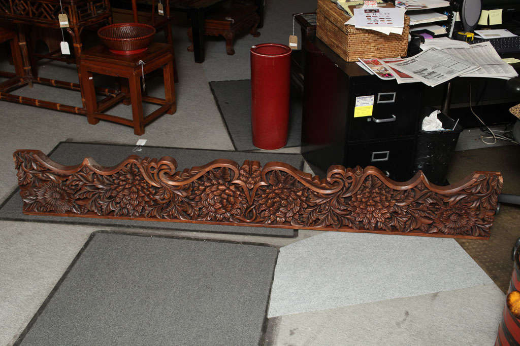 A large late 19th century Javanese deeply carved teak architectural panel with foliate design. This hand-carved teak architectural panel showcasing carved foliage motifs comes from the island of Java, where it was made during the late 19th Century.