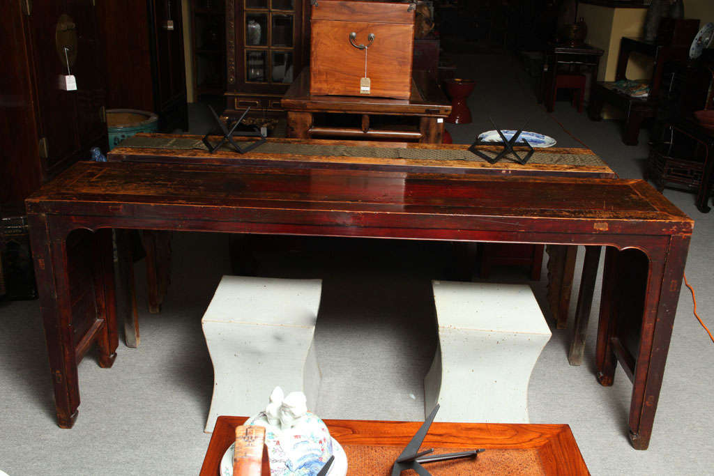 A Shandong seven-foot long elmwood console table featuring its original finish from the 19th century. This long console table comes from Shandong, an Eastern Chinese region, where it was made with lacquered elm during the 19th Century. The table