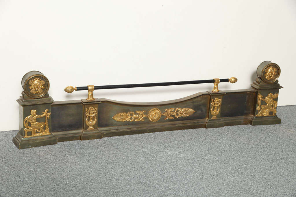 AN EMPIRE STYLE EXTENDING FIRE FENDER. FRENCH, CIRCA 1880