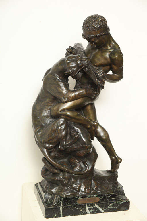 CAST FROM A MODEL BY EDOUARD DROUOT, THE GROUP DEPICTS A YOUNG MAN WRESTLING WITH A TIGER. SIGNED 