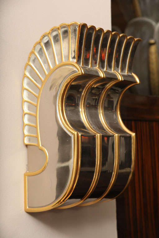 Egyptian Revival two-tone patina cast bronze wall sconce. One single available.