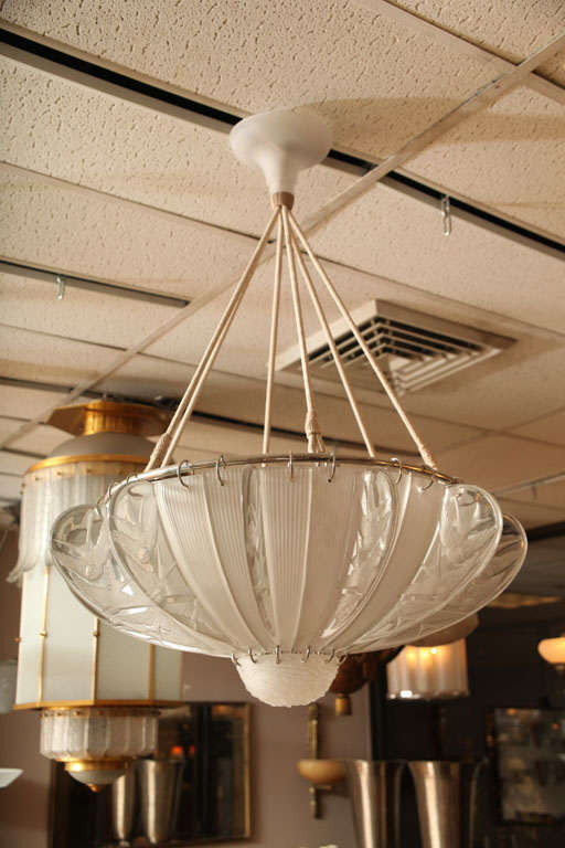 Rene Lalique chandelier composed of 12 panels decorated with sparrows, at the bottom is a stylized bird's nest. Original canopy. New cords as the old ones.
(pair available)