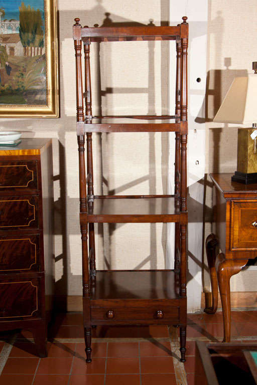 What is not to love about this beautiful four-tiered mahogany what-not? Generously tall at 62-inches, it is perfectly proportioned to stand between two windows and just look pretty. Decorate it with framed family photos or colorful tchotchkes and it