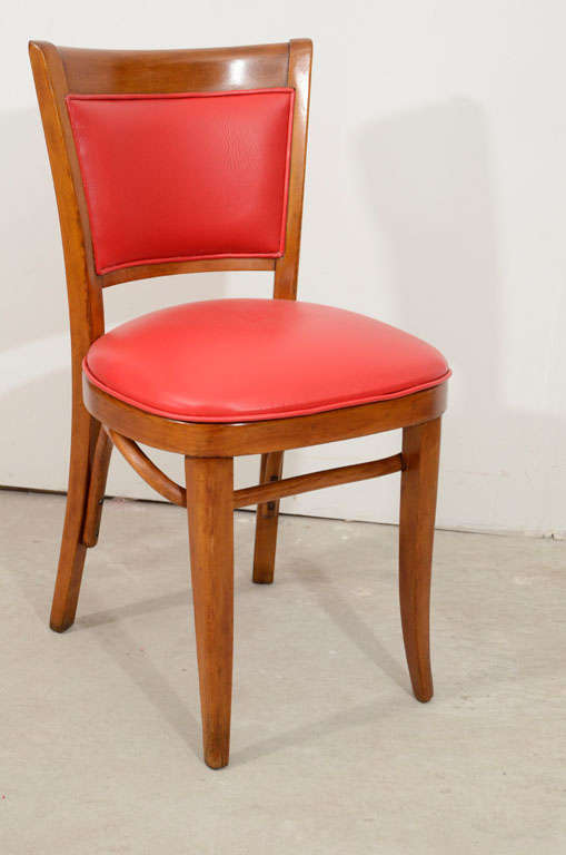 A set of six art Deco cafe chairs.The seat and the back are covered with red vinyl.