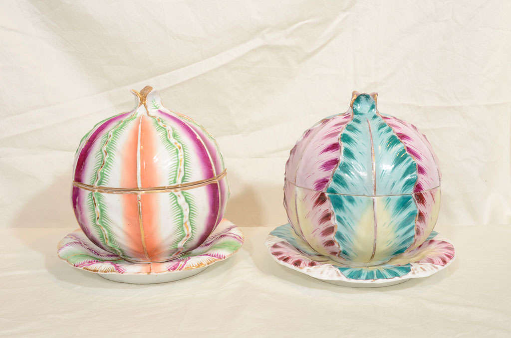 Provenance: From the collection of Katherine Mellon
A pair of brightly painted cabbage shaped tureens and stands made and signed by Jacob Petit, France c1845.
The cabbage shape is decorated with verticle bands of leaves decorated in bright colors.