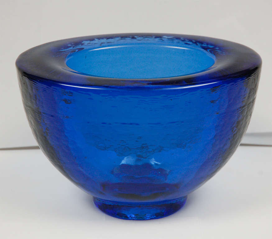 Thick glass bowl with unique wavy texture. This piece is by glass artist George Bucquet who creates unique contemporary, hand formed cast glass pieces using techniques that he has developed.