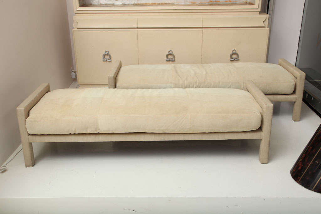 JOHN DICKINSON (1920-1982)
Pair of benches wrapped in ivory raw silk fabric with loose suede seat cushion.
American, c. 1968 
PROVENANCE
Residence of Mr. and Mrs. Donald Magnin, San Francisco, CA