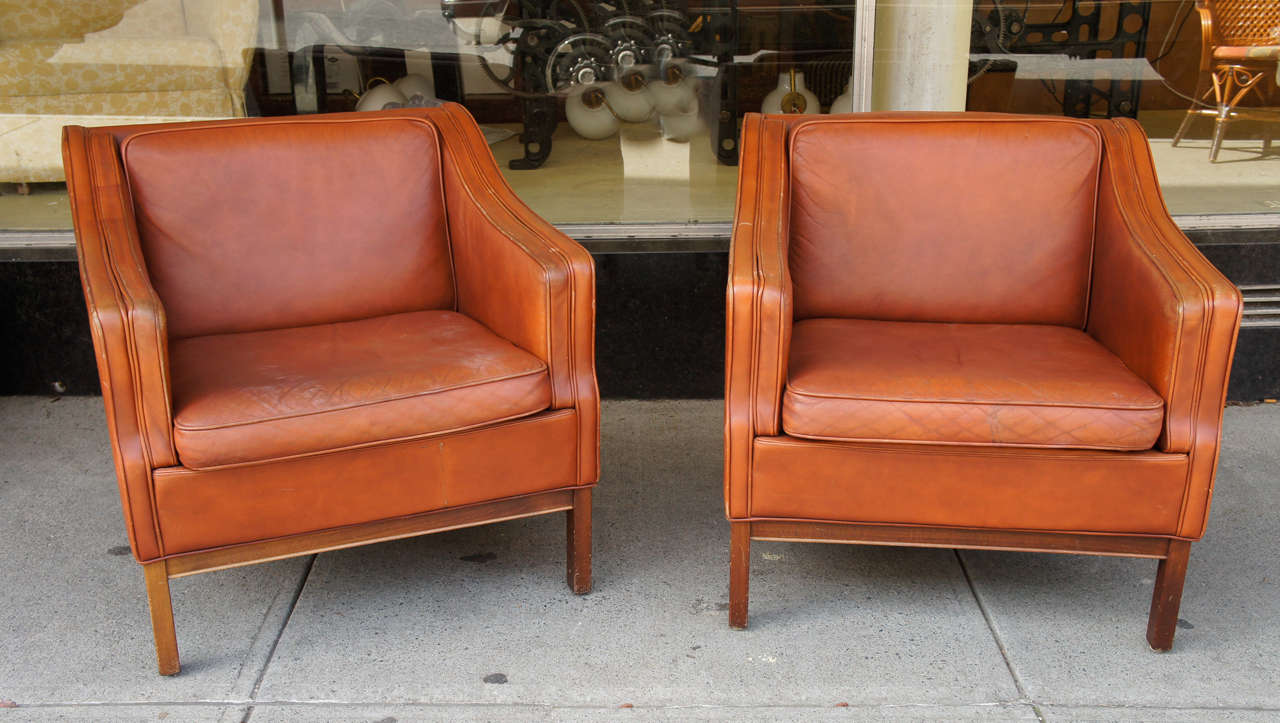 The leather upholstery on mahogany frames; Circa Early 60s.