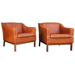 A Pair of Danish Modern Leather Upholstered Club Chairs