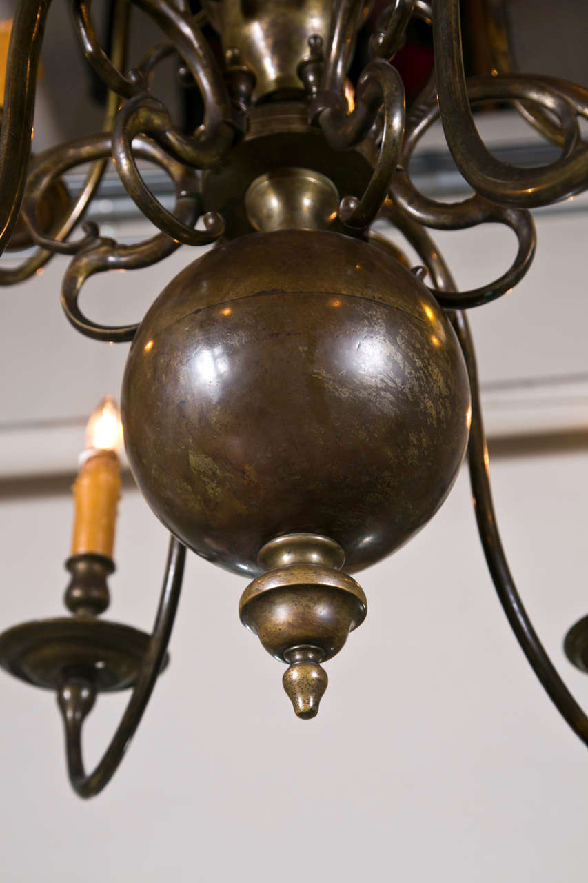 Fine antiques Georgian Style Chandelier From the Greenwich Home of Fashion Designor Tommy Hilfiger. The upper and lower tier having a group of six swag form candle stick arms. Has 48 inches matching chain. Electricfied and ready to use.