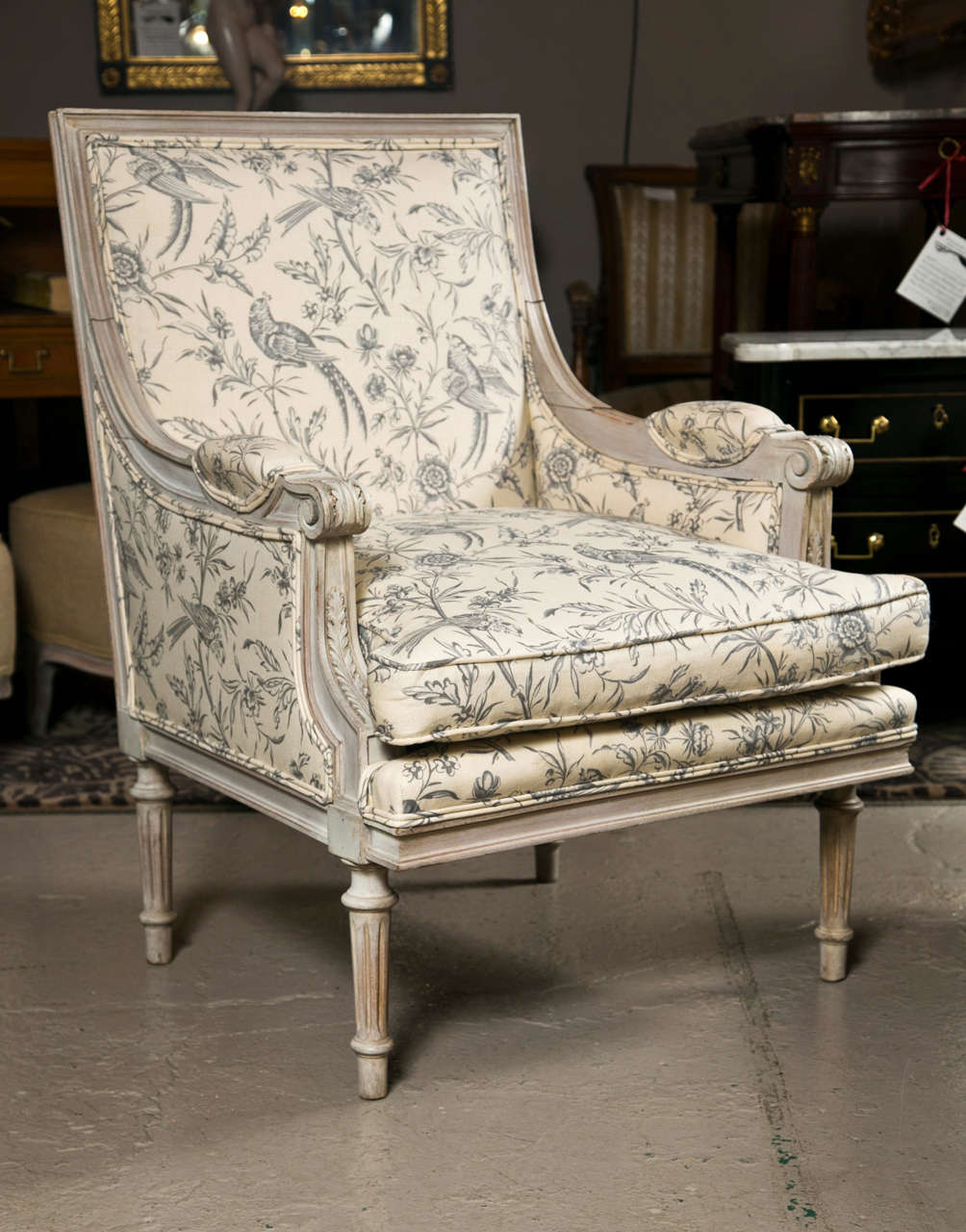 Lovely pair of distress painted bergere chairs, beautiful frame in Swedish finish, upholstered in toile fabric, padded back and arm-rests, cushioned seat, raised on fluted legs. By Jansen.