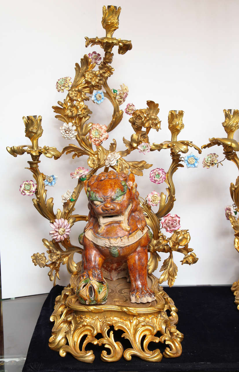 Large Pair of porcelain and bronze figural candelabra with foo dogs on gilt bronze reticulated base with porcelain flowers
The Sancai dogs are likely to be a late 19th century marriage.
Stock number: LC9.