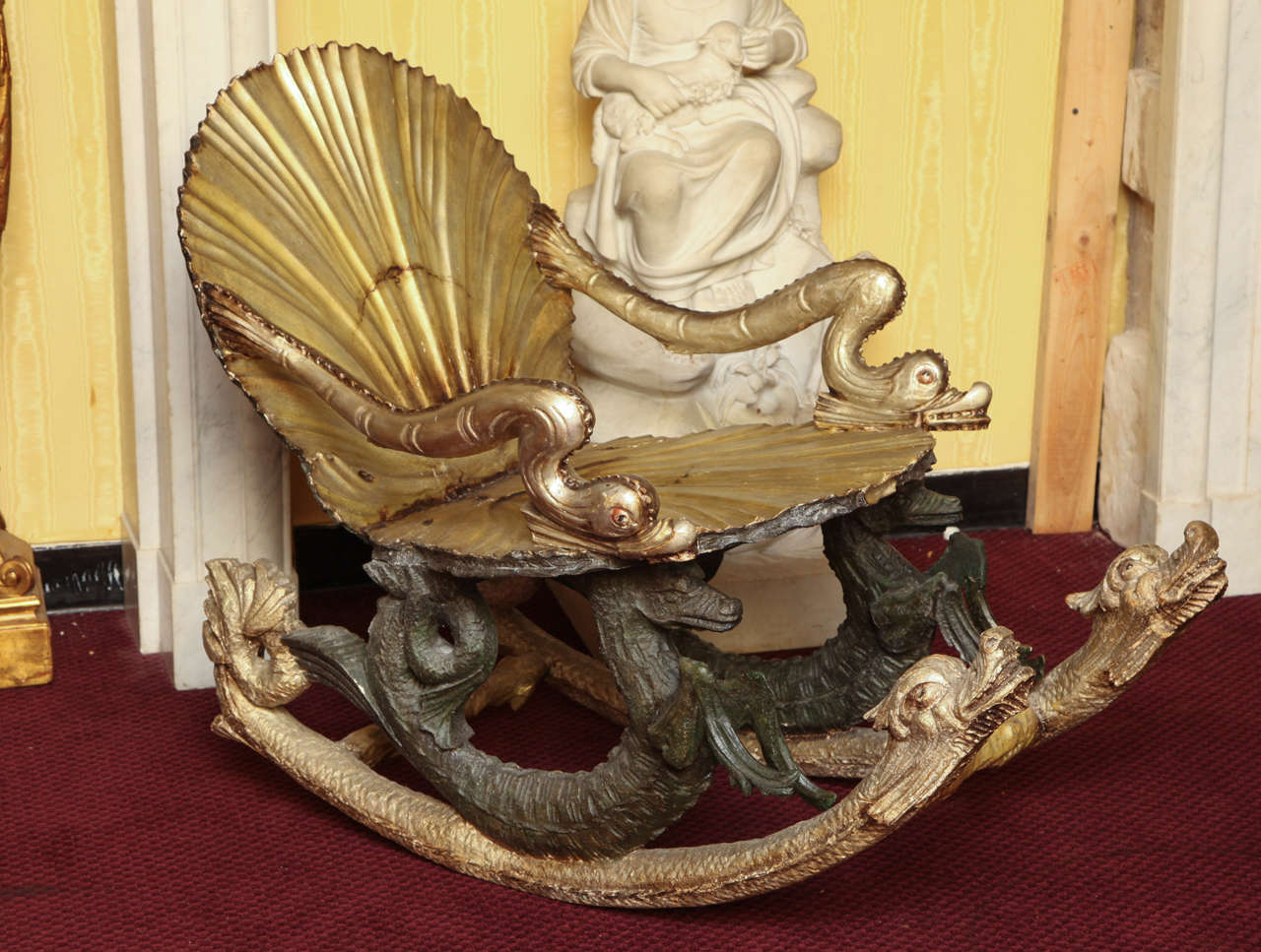 A fine Venetian Grotto silvered rocking chair with animal figures with seashell motif.