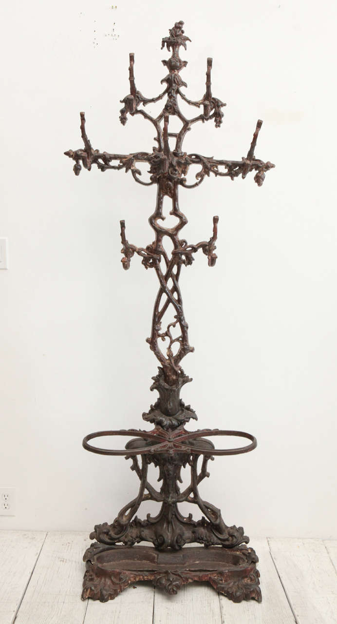 Ornate and eccentric coat rack and cane and umbrella stand.