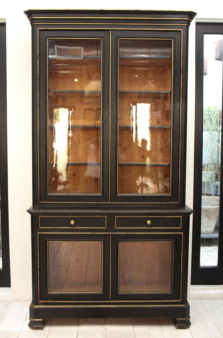 Impressively scaled china cabinet with glass doors and adjustable shelves.