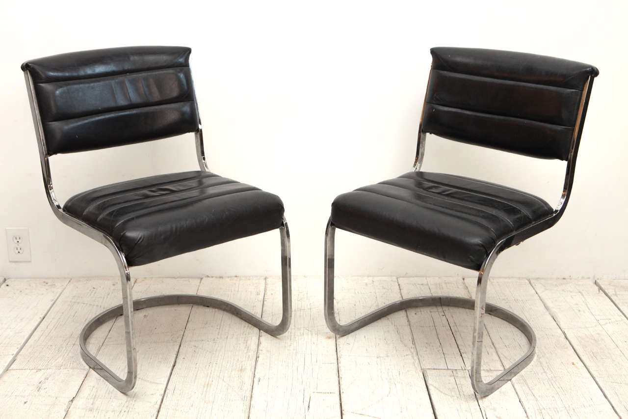 Vintage mid-century curved back dining chairs.