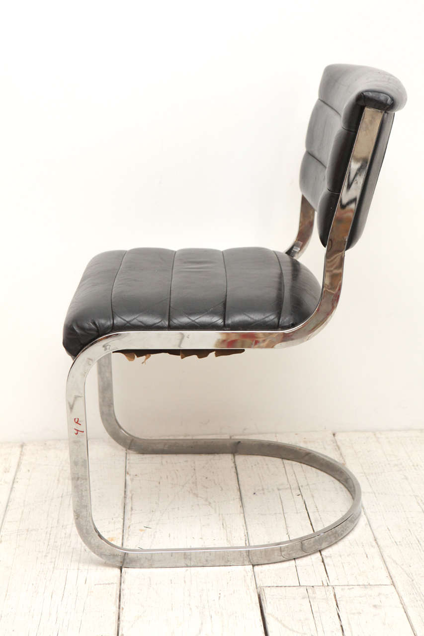 Mid-Century Modern Set of Four Ribbed Black Leather and Chrome Cantilever Dining Chairs