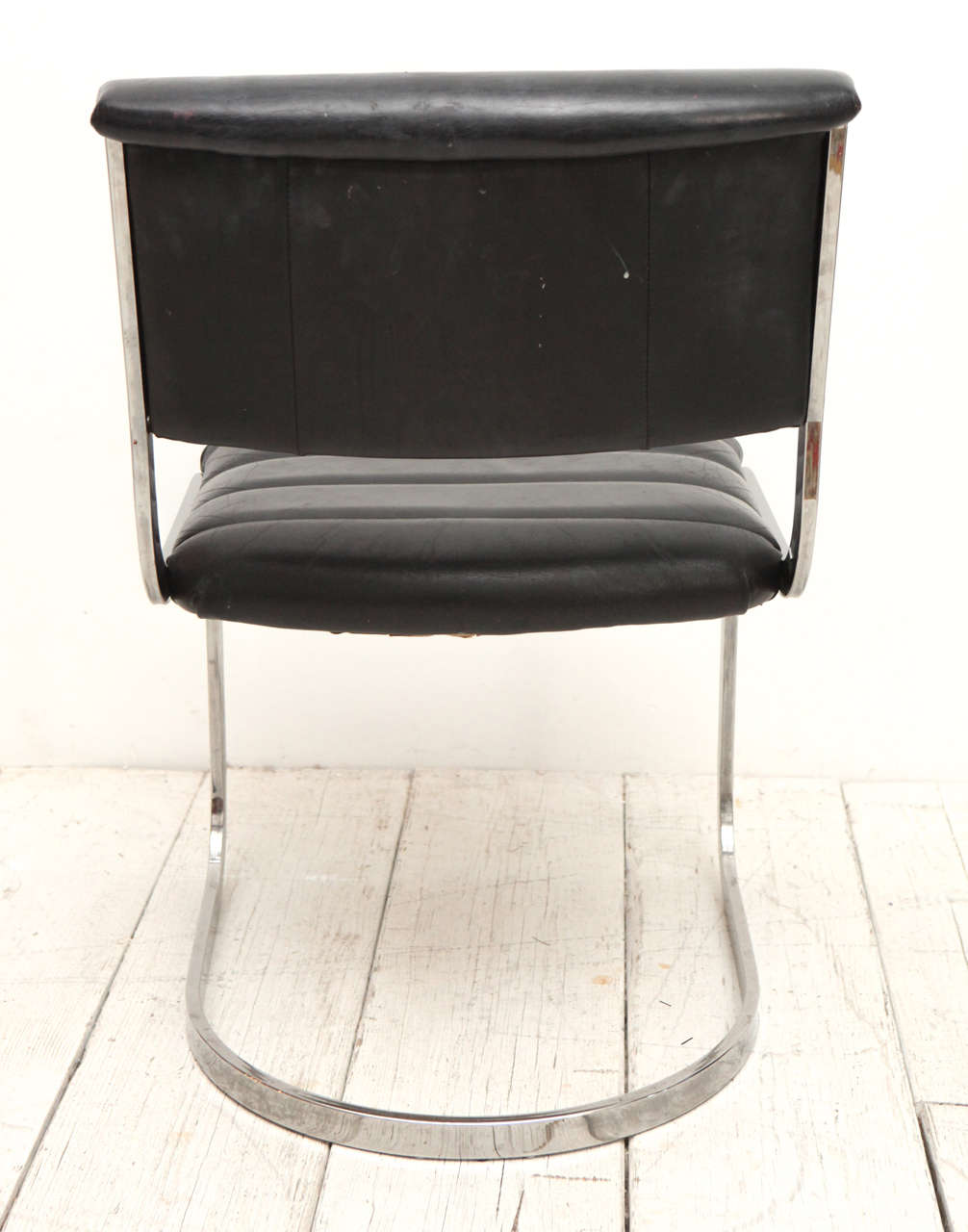 Set of Four Ribbed Black Leather and Chrome Cantilever Dining Chairs at