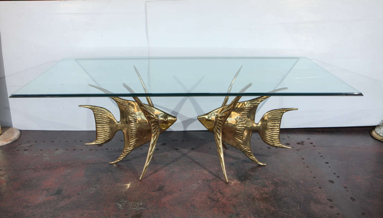 Rare Alain Chervet fish table
4 of 150 limited edition
This table includes two solid bronze fish with the mark by the designer and the glass top
The measurements below are for the whole table with the existing glass top
Each fish: 28.5