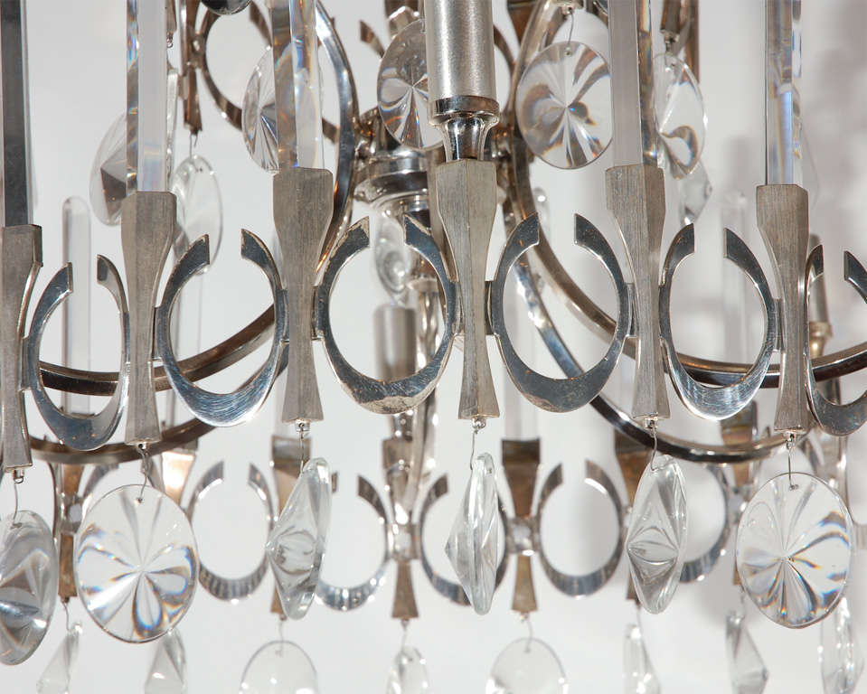 Delicate crystal and silver plate chandelier by Gaetano Sciolari; nine arms.