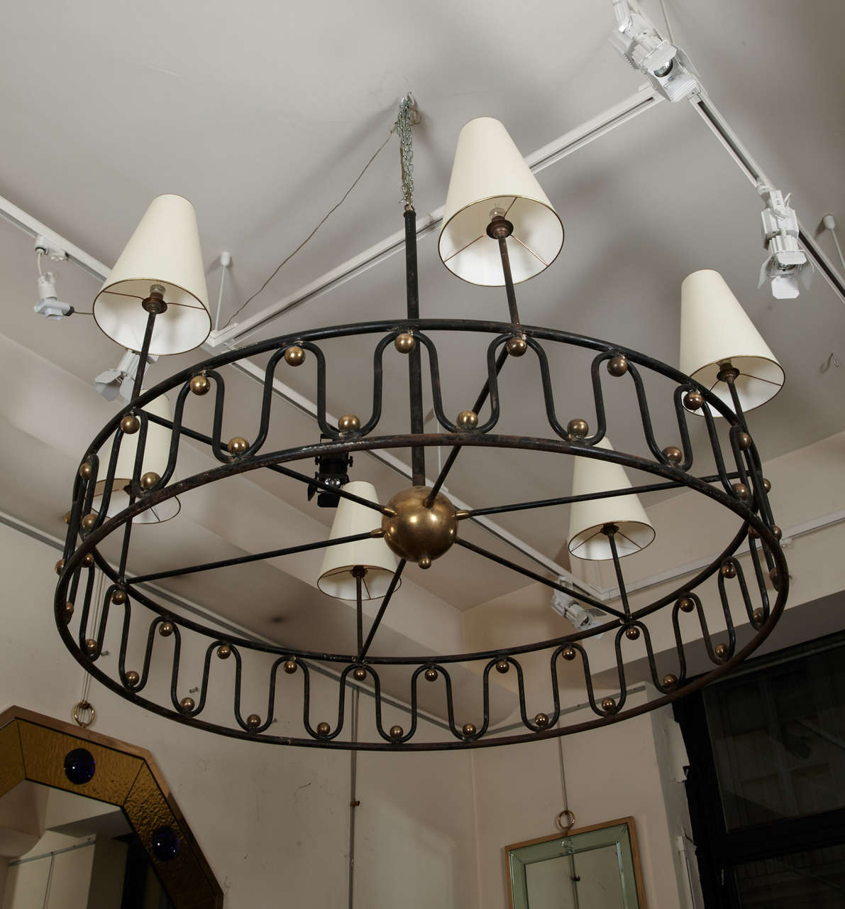 Jean Royère rarest huge model serpentine six-light chandelier in black painted wrought iron and brass balls.