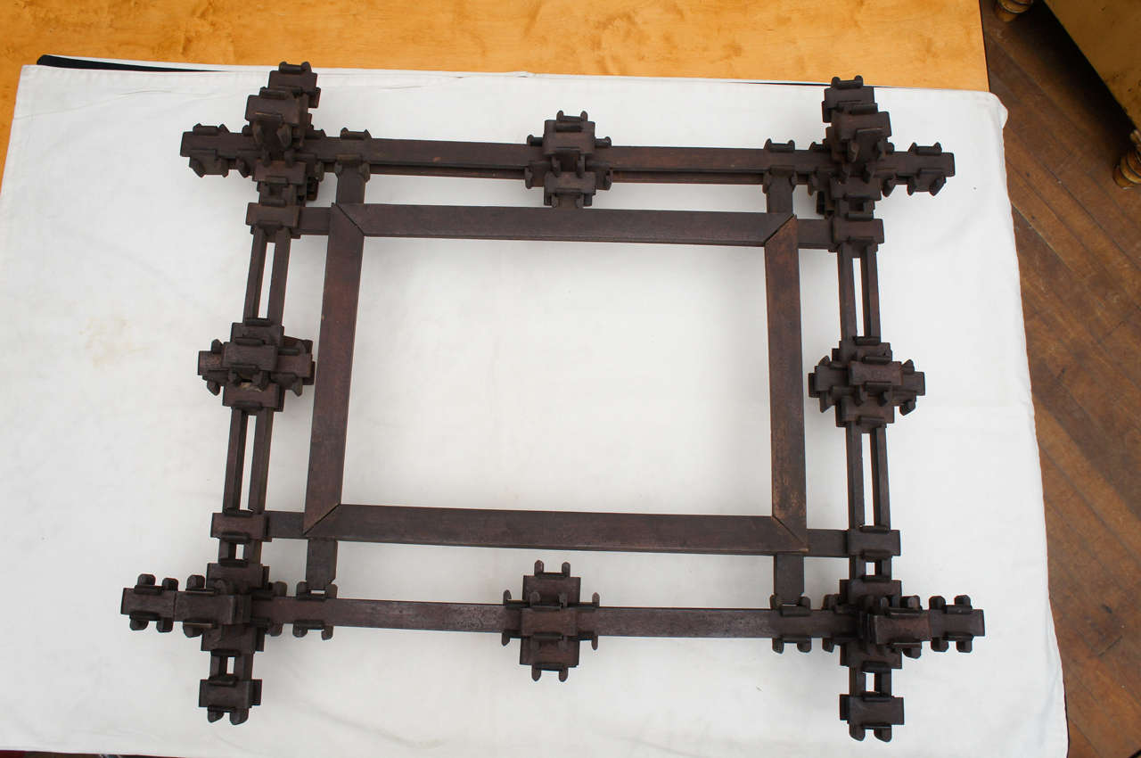 This  Frame is Created with Hand Made Carved Interlocking Puzzle Pieces.  It is Unusual in Its Spareness and Not made in the Usual 