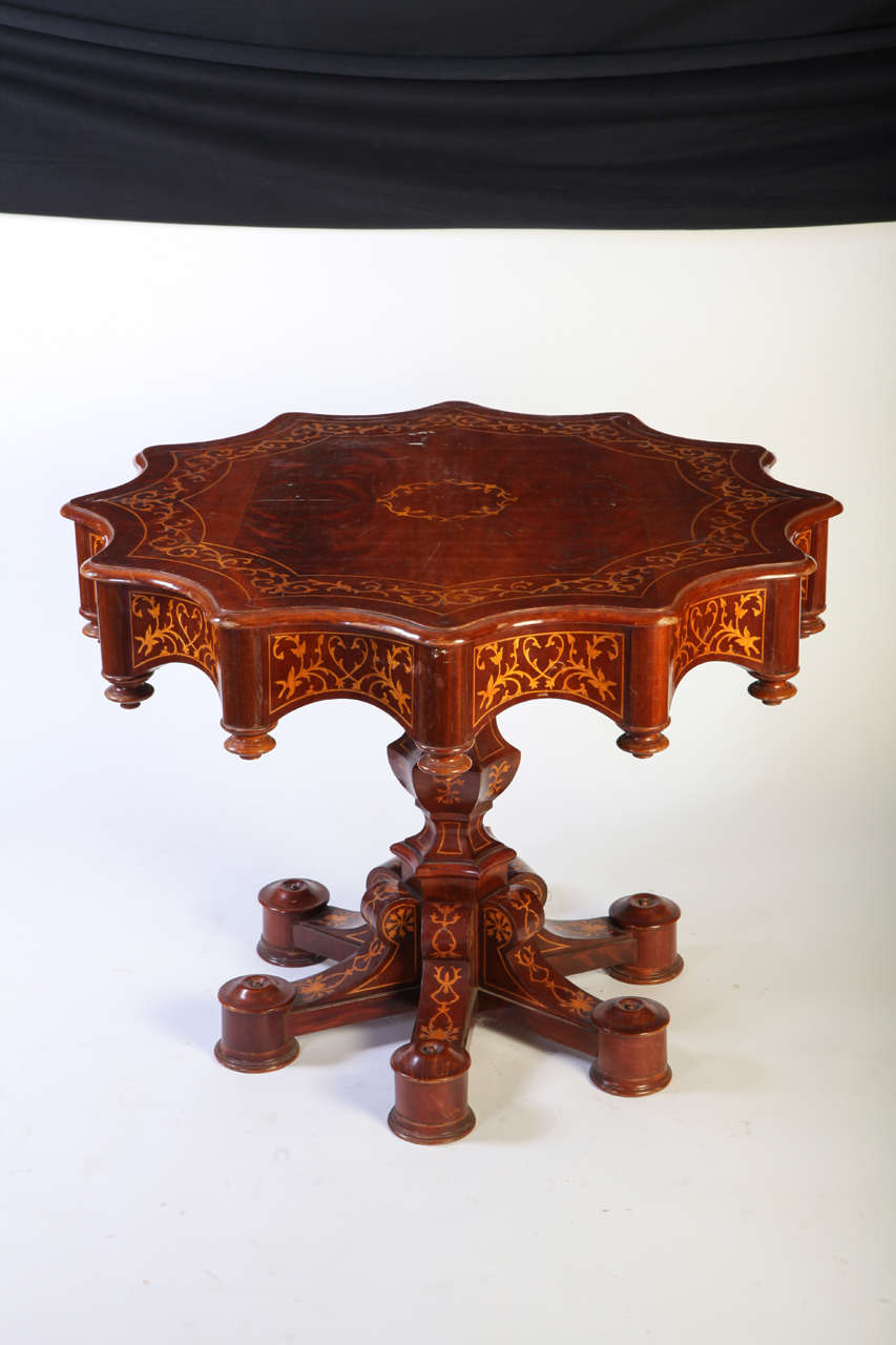 A fine 19th century Italian inlaid center table.