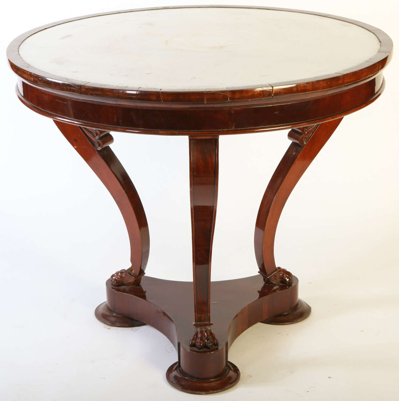 An italian mahogany  white marble toped   gueridon table .
Directoire period.
cm 100x84