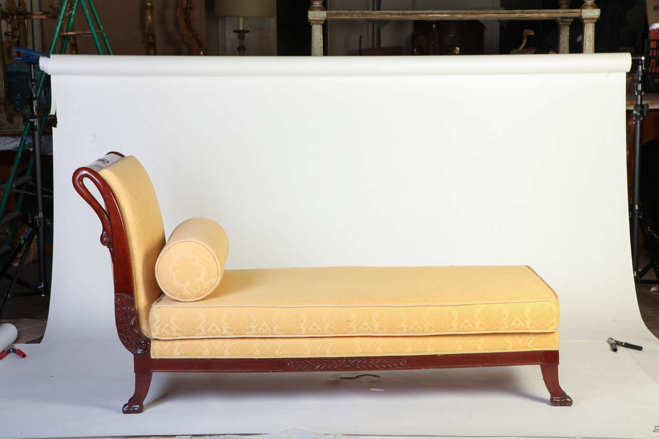 A fine tuscany mahogany Swan neck sofa
The front side of the curved arm ends on carved swan, The settee rests on four lion paw feet.
 Upholstery in a very good condition.