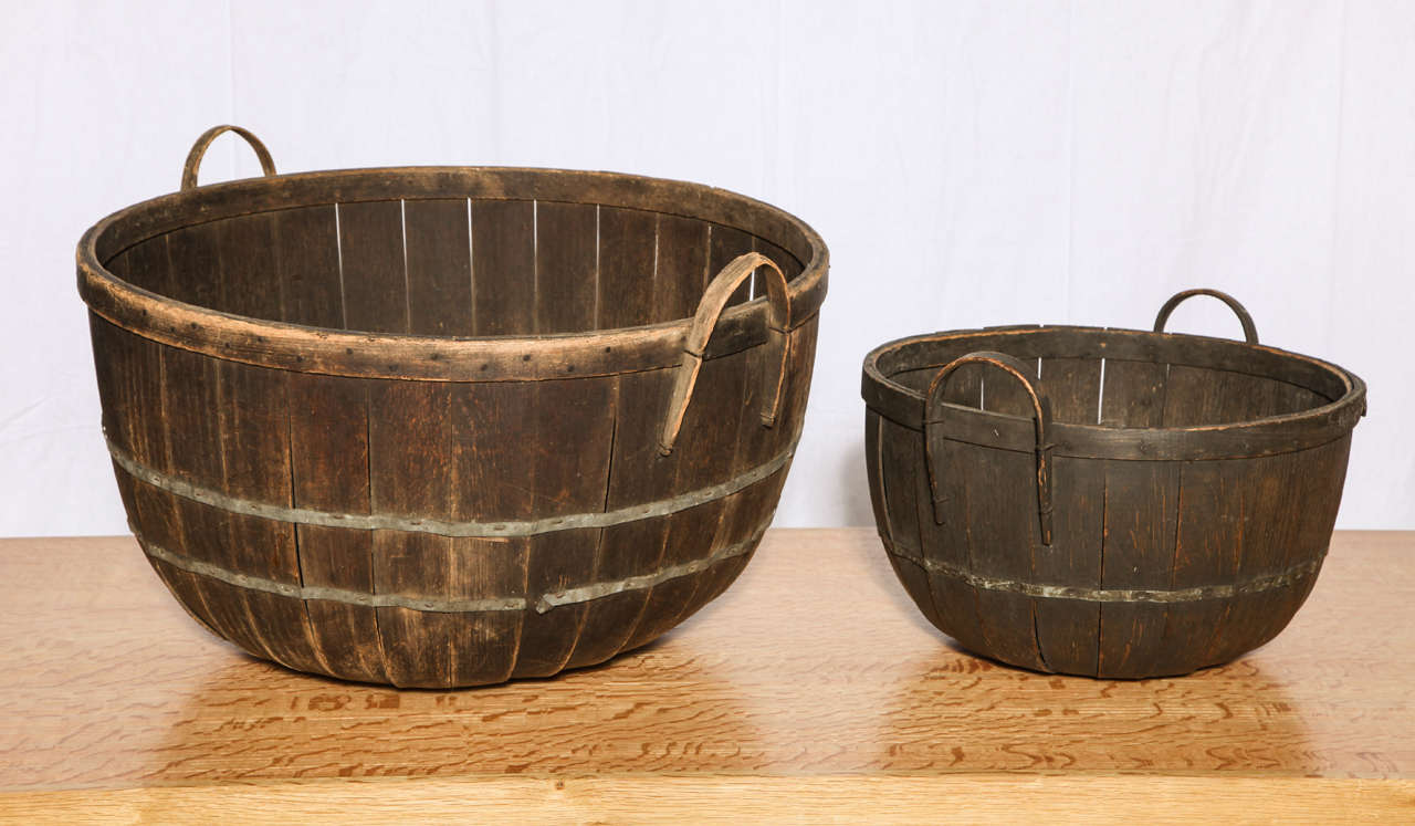 Two Missouri apple baskets in 2 different sizes.