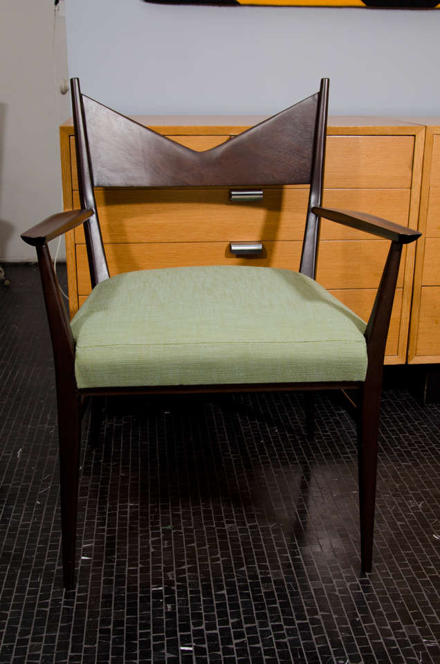 Paul McCobb single dining chair with arms and upholstered seat.  Mahogany frame in an ebonized finish.