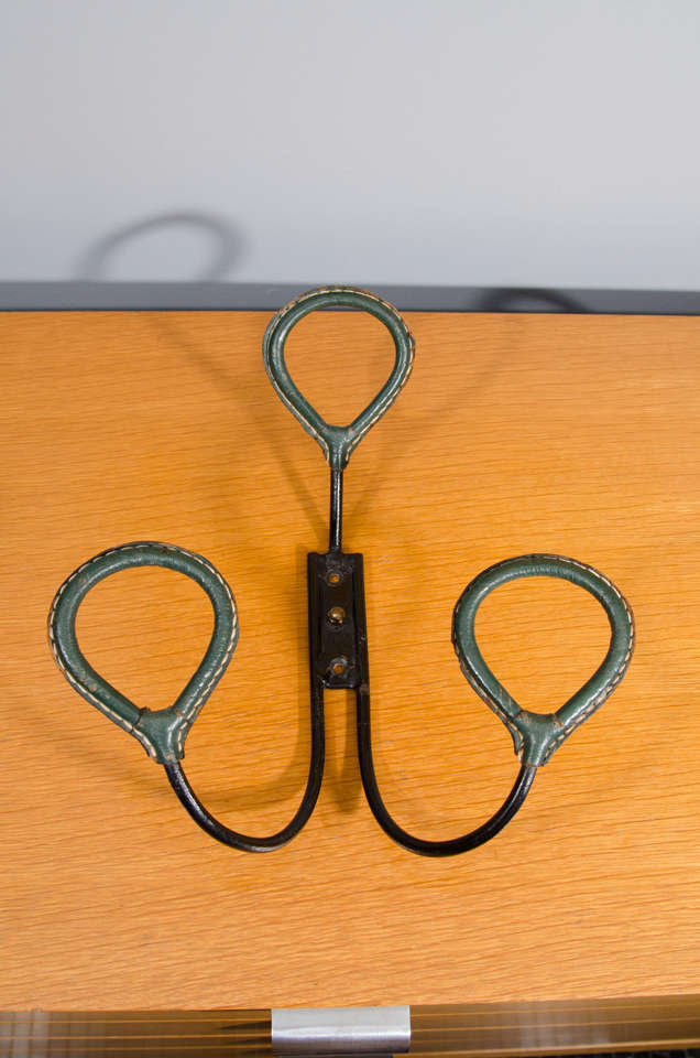 French 1950's iron and green leather coat rack.